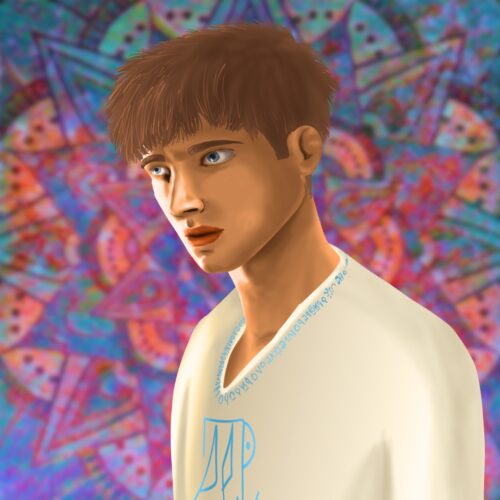 White man with brown hair wearing a shirt with bright blue embroidery