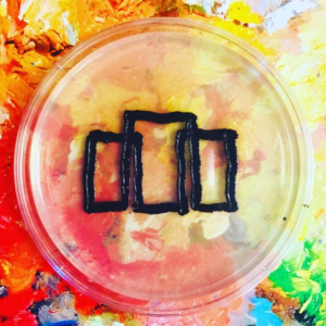 Logo of the letter M in Agar Art by Sarah Adkins
